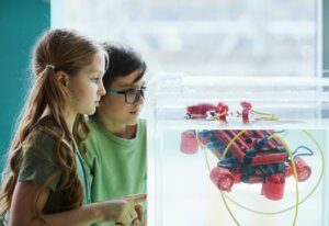 Thumbnail For Two Children Operating Robotic Boat While Experimenting Engineering Lab School STEM Coding for Kids By The Young Maker