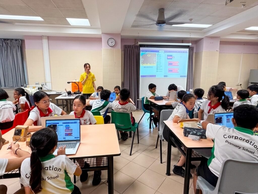 The Young Maker instructor teaching a micro:bit sustainability programme to Primary 5 students at Corporation Primary School