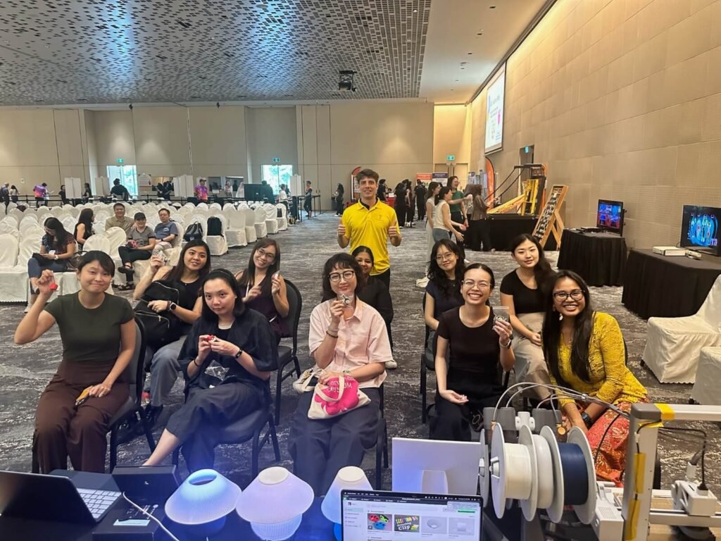 National Heritage Board 3D printing workshop: staff holding up their Peranakan tile clickers